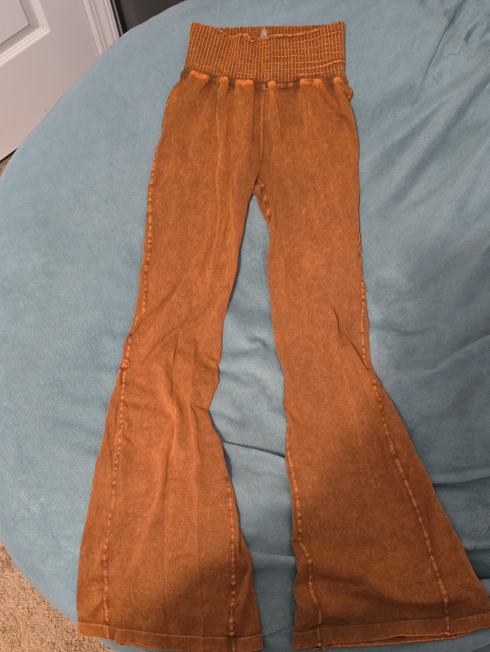 Free People High-Waist Flared Pants in Rust Orange